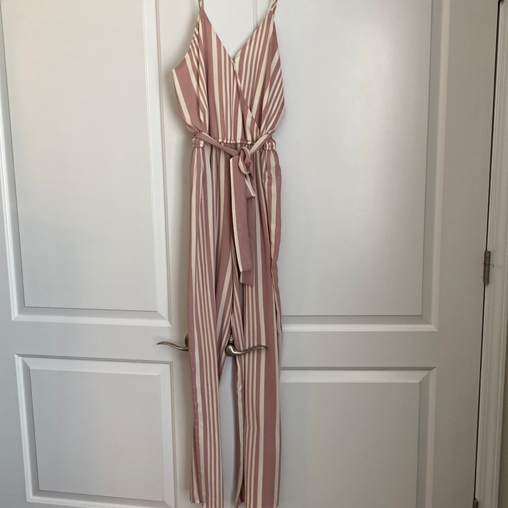 Pink and cream striped jumpsuit.